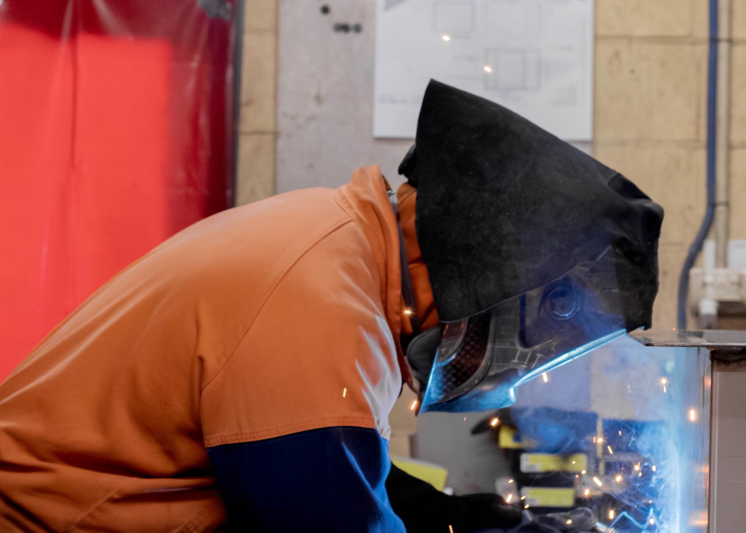 A welder at work in the RH Freeman workshop